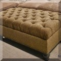 F59. Tufted storage ottoman. 